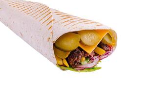 Delicious wrap filled with fresh vegetables and savory meats photo