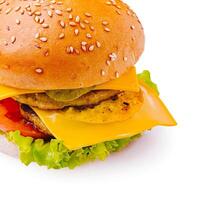 Delicious cheeseburger with fresh ingredients on a white background photo
