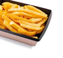 Enjoying crispy golden fries served in a stylish container photo