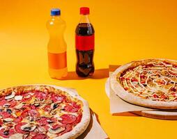 Enjoying delicious pizzas and refreshing drinks on a colorful backdrop photo