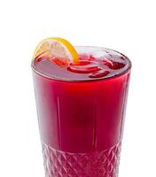 Refreshing berry beverage in a clear glass with citrus garnish photo