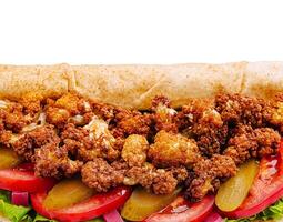 Crispy cauliflower wrap with fresh vegetables and toppings photo