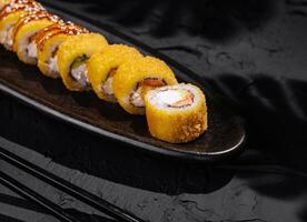 Exquisite mango sushi roll on elegant plate close up photo