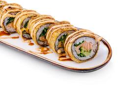 Unique fried sushi rolls presented on a decorative plate photo