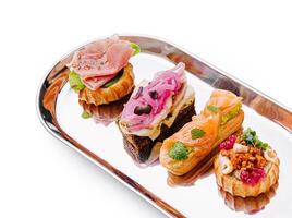 Gourmet canapes served on a silver platter at a stylish event photo