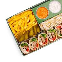 Delicious wrap platter with fries and dips ready to enjoy photo