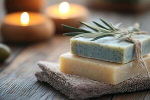 Handmade natural soaps with aromatic candles on wooden table photo