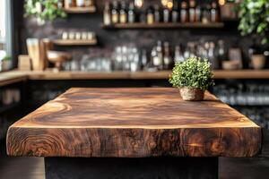Empty wooden table with blurred bar background showing alcohol bottles and shelves photo