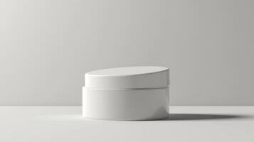 A white container with a lid sitting on a table photo