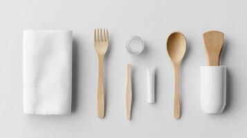 A set of utensils including a fork, spoon and napkin photo