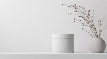 A vase and a white container sitting on a shelf photo