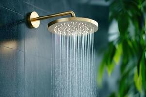 Luxurious rainfall showerhead mounted on a sleek black marble wall with cascading water in a spa-like atmosphere photo