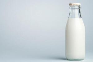 Classic glass milk bottle with vintage cap features minimalist design against a clean white background showcasing simplicity and nostalgia photo