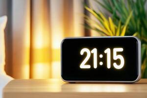 Smart home digital clock displays time in modern bedroom with soft ambient lighting and voice assistant feature photo