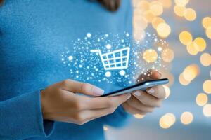 Shopping online with a smartphone as discount icons and a shopping cart appear in a modern e-commerce setting photo