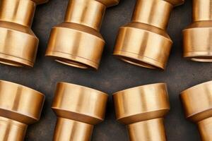 Close-up view of bronze fittings arranged in a symmetrical pattern on a dark background showcasing the craftsmanship and design details photo