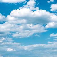 Fluffy Clouds Against a Vibrant Blue Sky photo
