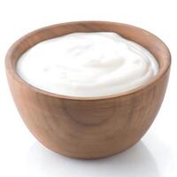 Yogurt in a wooden bowl on a white background photo