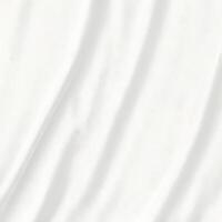 Closeup view of a white fabric texture showing subtle folds and creases photo