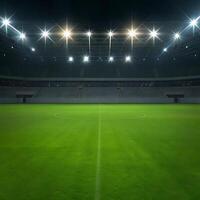Night view of an empty soccer stadium with bright lights illuminating the green field and empty stands photo