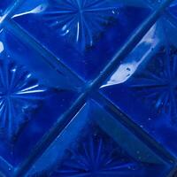 Closeup of a Deep Blue Glass Surface with Starburst Etched Pattern photo