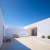 Minimalist White Architecture Courtyard Design with Wooden Bench and Planters under Bright Sunny Sky photo