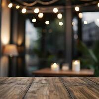 Rustic Wooden Table with Blurred Background of Cozy Cafe at Night with String Lights photo