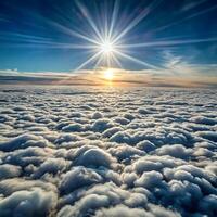 The sun shines over the clouds in this photo