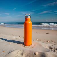 Orange Hydration Bottle on a Sunny Beach photo