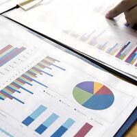 Business Financial Report Analysis Showing Charts and Graphs of Data photo