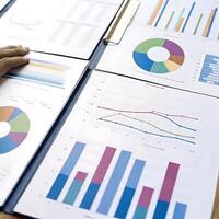 Financial Report Analysis Showing Charts and Graphs of Business Data photo