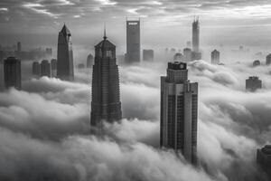 Stunning black and white cityscape photograph of skyscrapers emerging from a thick fog photo