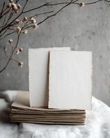 Vintage Mockup of Blank Cards on a Stack with Natural Atmosphere and Delicate Floral Accents for Creative Designs photo
