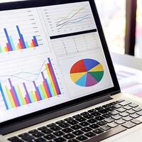 Laptop Displaying Colorful Business Graphs and Charts Data Analysis Visualization photo