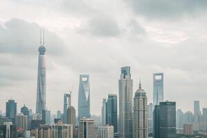 Shanghai Skyline under a Cloudy Sky Featuring the Shanghai Tower and Other Iconic Skyscrapers photo