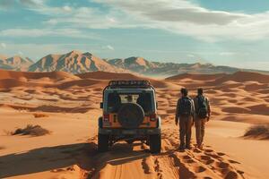 Two men standing in the desert with a jeep photo