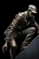 A bronze statue of a man climbing a wall photo