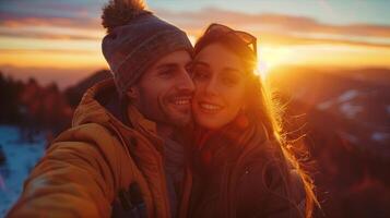 A man and woman taking a selfie at sunset photo