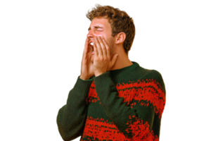 Man in red and green sweater covering face in despair on transparent background png