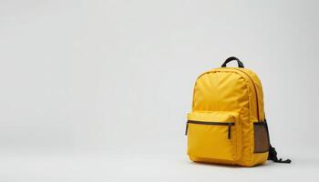 Bright yellow backpack displayed in a minimalist setting, ideal for students or outdoor enthusiasts seeking a vibrant and functional choice. photo
