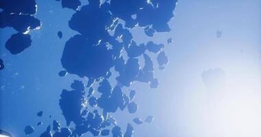 Stunning view of rocky asteroids floating in the deep blue space environment video