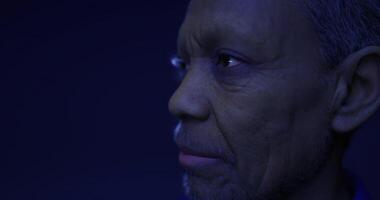 3D rendering of an elderly man with a thoughtful expression in darkness video