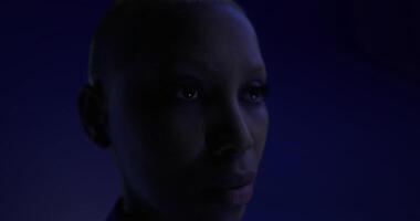 Portrait of a person with a striking look in dark lighting setting video