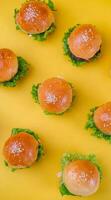 Top View of Mini Burger for Isolated on Yellow Background photo