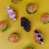 Top View of Mini Croissant Isolated on Yellow Background photo