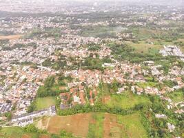 Aerial Landscape view of massive civilization and population. High angle view of Residential District and Cityscape. Densely Populated Settlements. Bandung City View, Asia photo