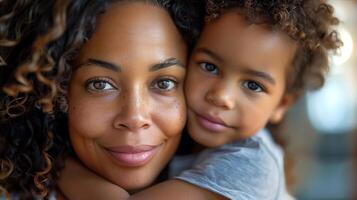 A woman and a child are hugging each other photo