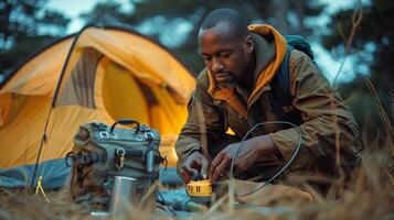 A man is using a portable generator to power his tent photo