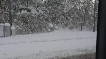 View through bus window in Munich, Germany of snowy streets, snow covered city, snowy fairy tale. Public transportation in Muenchen in winter. A lot of snow in Munchen. Snow collapse in Deutschland video