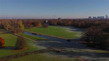 Schwabinger Bach is stream in Munchen, Bavaria, Germany. Starts in centre of Munich, flows through Englischer Garten and flows into Isar river. Schwabinger Bach aerial view in autumn in sunny weather. video